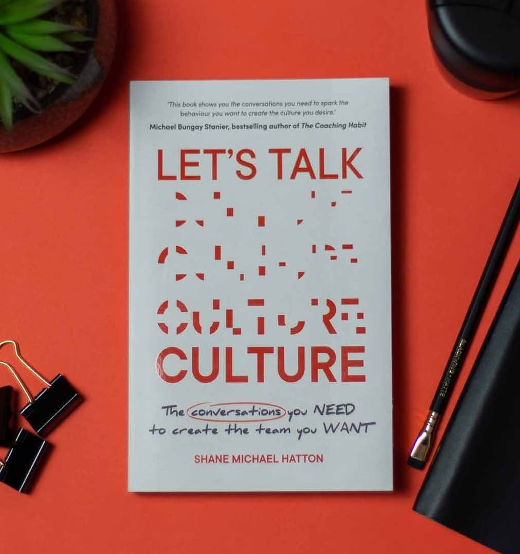 Let's Talk Culture by Shane Michael Hatton, on a desk